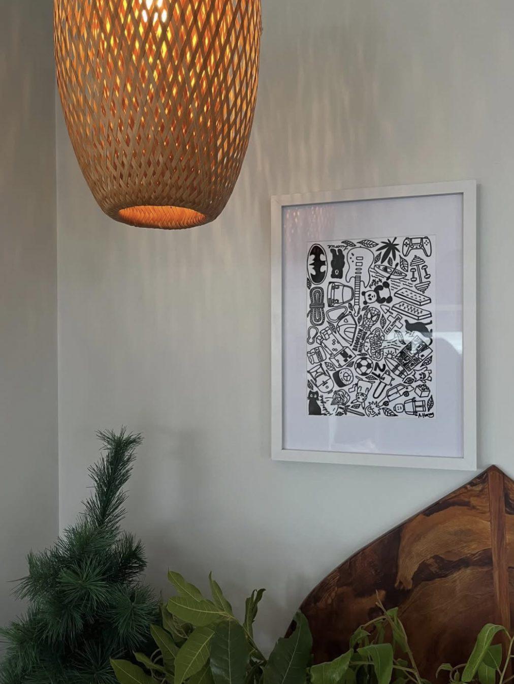 A framed memory print hanging on a wall at home